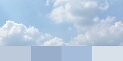 An ornate antique silver serving tray with intricate embossed floral and geometric patterns. The tray features a scalloped edge with decorative handles on both sides and a central medallion surrounded by quilted texturing. Below the tray is a color palette extracted from the image showing four swatches in various shades of brown, from light taupe to deep chocolate, demonstrating the Color Palette Extractor tool's functionality.